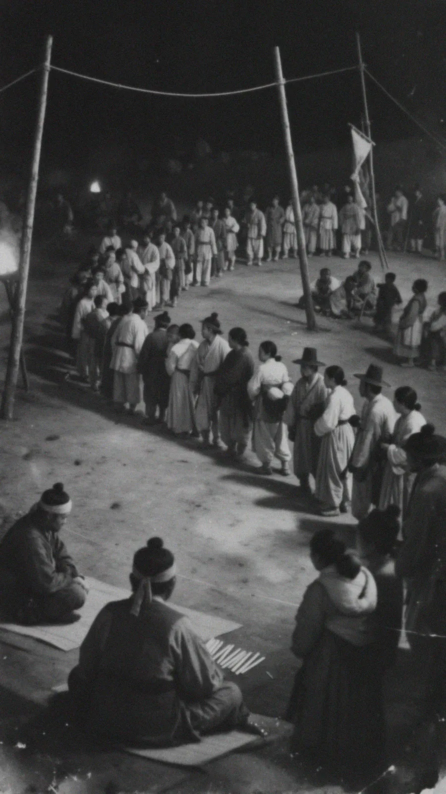 A night market. Behind Pansu, his counting rods spread on a straw mat, a long line of people waits its turn